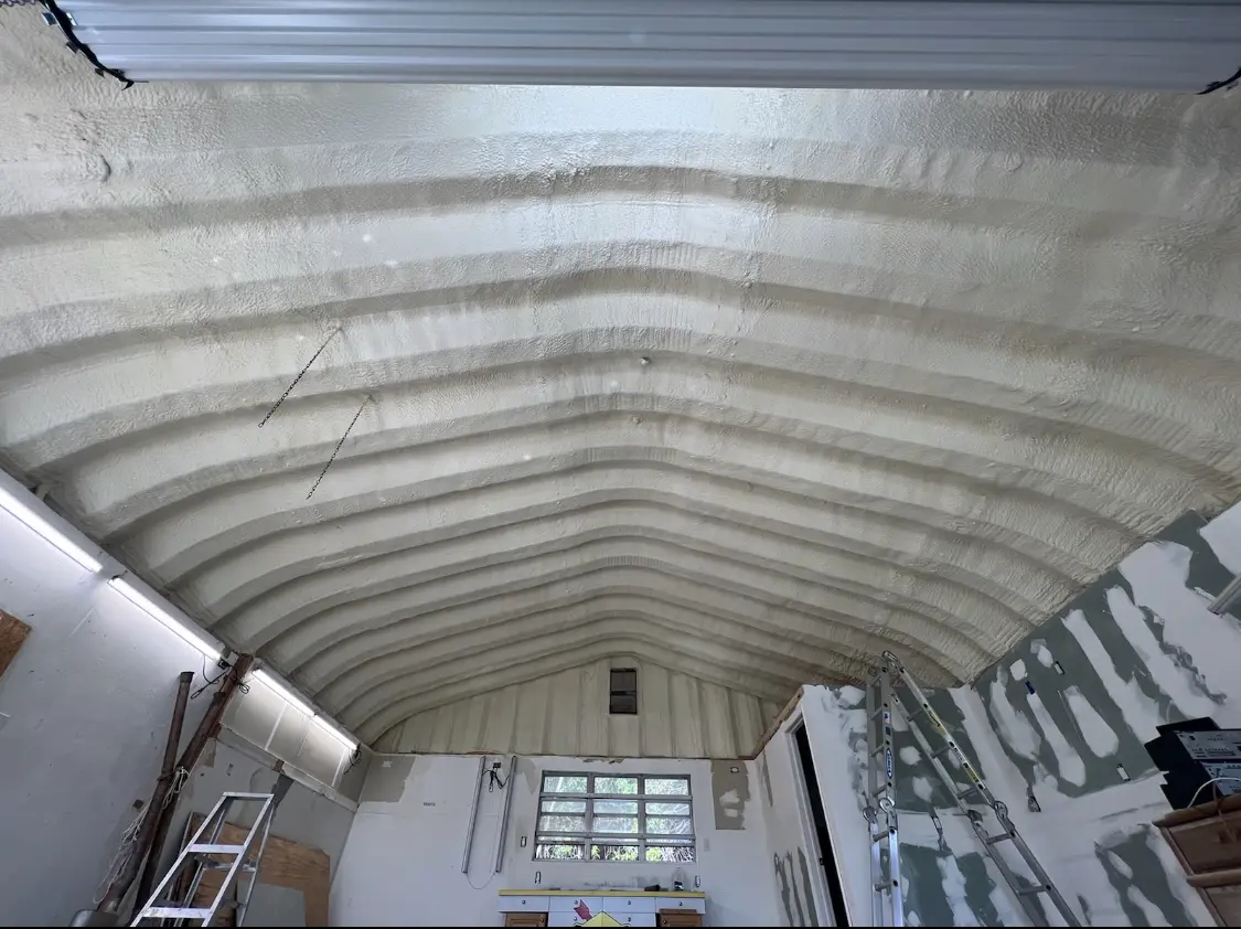 Spray polyurethane foam applied to the underside of a metal roof deck in Wellington